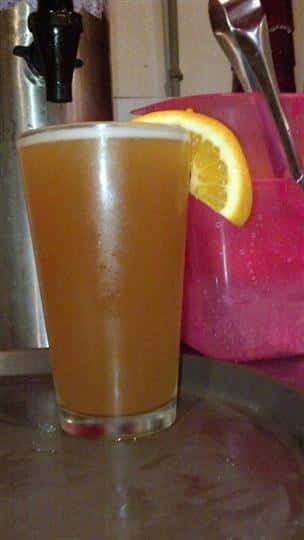 Beer with an orange garnish