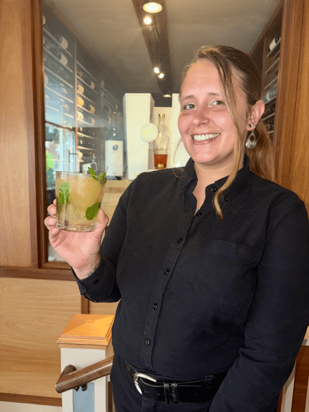 bartender holding a happy hour cocktail