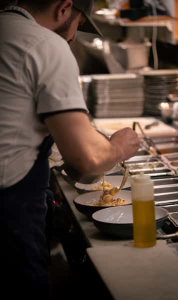 Chef preparing pasta dish