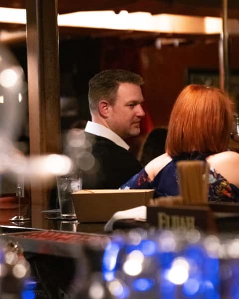 Couple enjoying date night dining at Prohibition speakeasy restaurant in Murray Utah