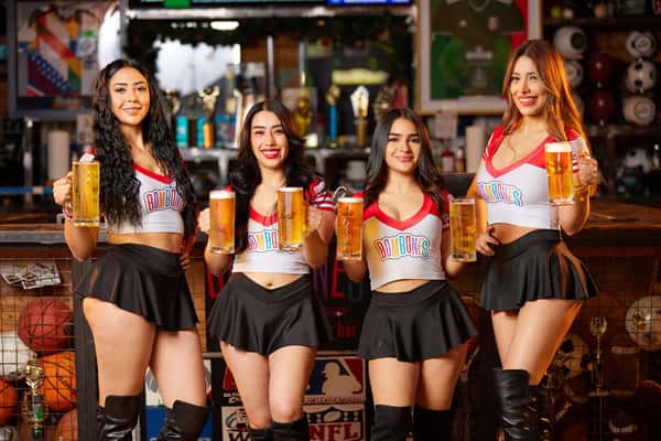 Waitresses holding coldmugs of beer