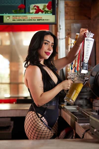 Waitress at a beer tap