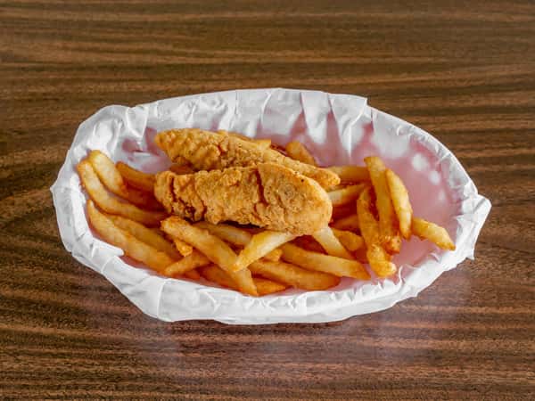 Miller's Cafe fried chicken tenders and golden french fries served in a white paper-lined basket on a wood table.