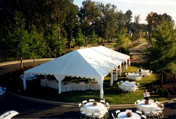 big tent outdoors with tables and chairs