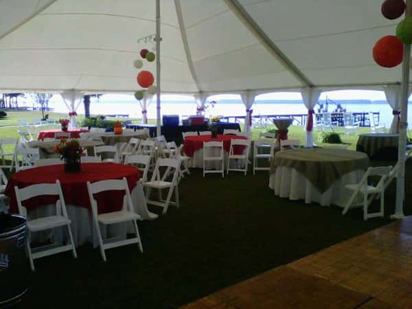 tent with many chairs and tables under it