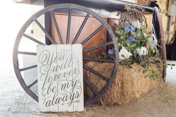 a wagon wheel and a sign that says "You will forever be my always"