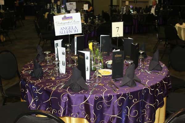 a table cloth with napkins and name placecards