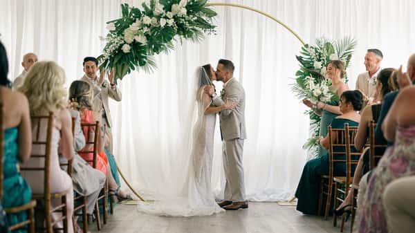 Ceremony is sealed with a kiss