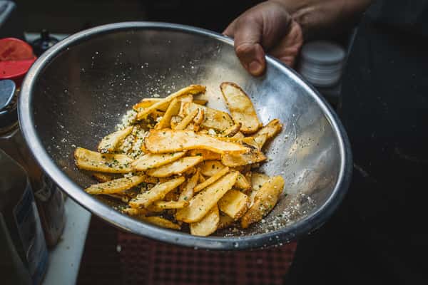 chef tossing fries