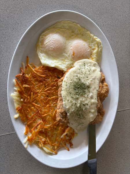 A Tennessee Grill plate of country fried steak with eggs and hash browns.