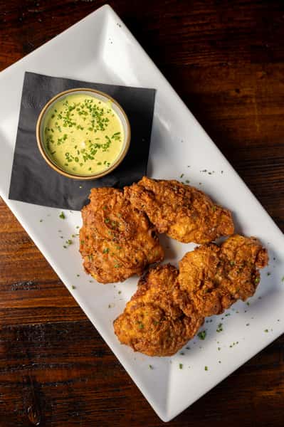 house brined chicken thighs, battered and fried with McDonnells Ranch