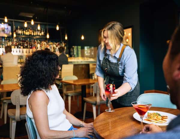 Waitress serving customer