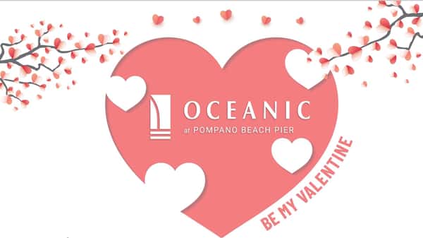 Oceanic logo in a pink heart with pink heart tree branches