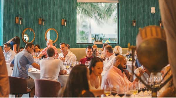 Guests enjoying wine at Oceanic at the Pompano Pier
