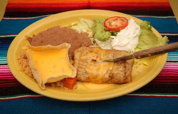 Burrito with taco bowl cheese cup, beans and salad