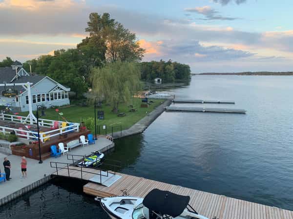 Rideau Lake, boat docking, willow trees, public docks, outdoor seating
