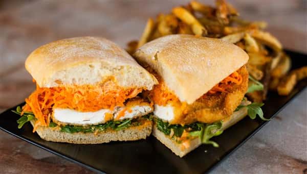 Queen Schnitzel with carrot slaw, lakeside dining,