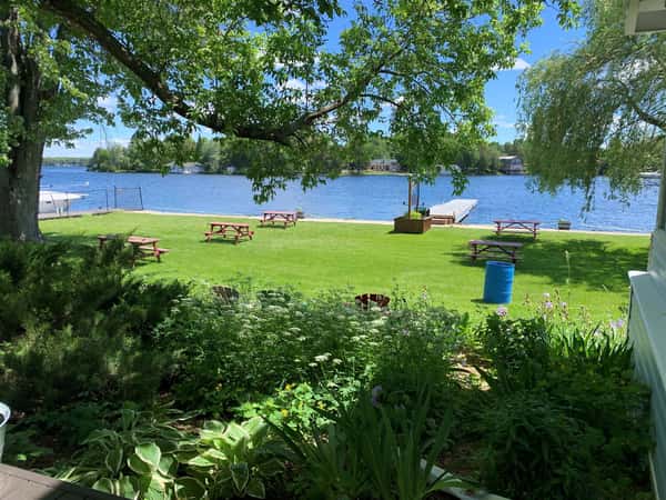 Pastoral views, relaxed outdoor seating, lakeside dining, sun and shade