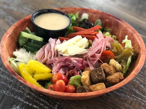 italian godfather salad with a side of dressing