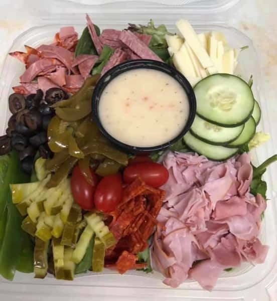 italian godfather salad with a side of dressing