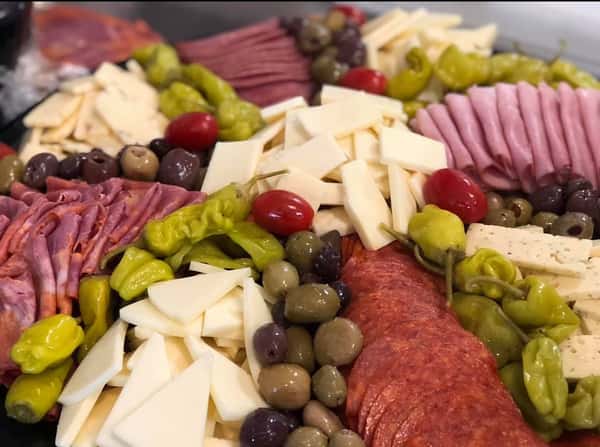 meat and cheese platter with olives