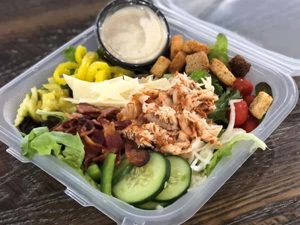 shredded chicken salad with bacon, cucumbers, tomatoes, and banana peppers