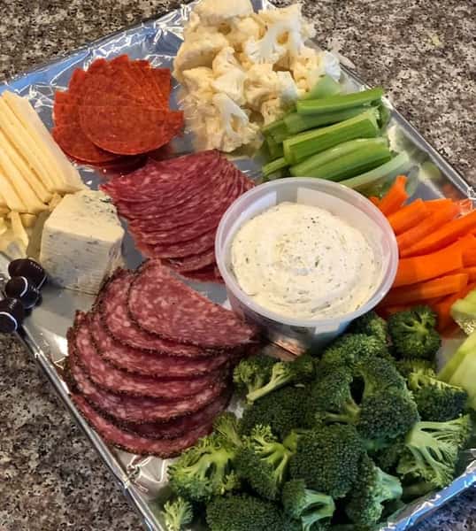meat and vegetable platter with dipping sauce