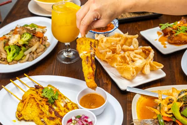 person eating satay
