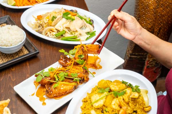 person eating with chopsticks