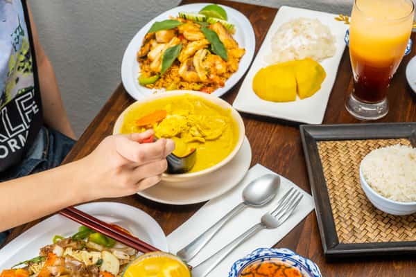 person eating yellow curry