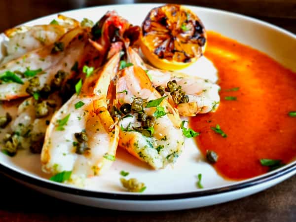 Big Shrimp Pimpin' - Half pound of chilled shrimp served with grilled lemon and red menace sauce