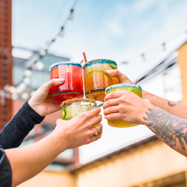 Cheersing Margaritas at Federales with CLASSIC $14 Skinny or Spicy available MEZCAL $14 BLOOD ORANGE $14 RASPBERRY $14 CUCUMBER JALAPEÑO $15 SPICY WATERMELON $15 CADILLAC $15