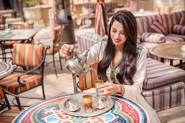 woman pouring tea