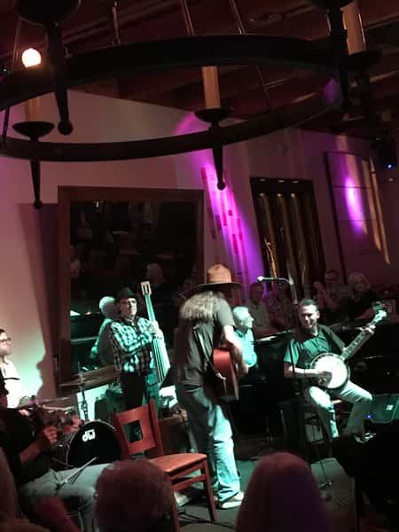 band performing singer guiter player bass and drums