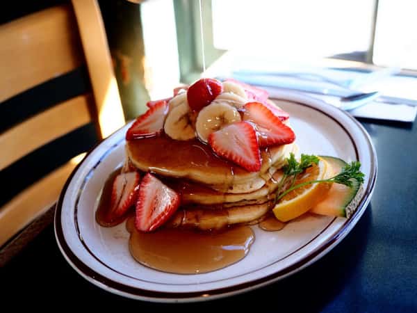 Fluffy Buttermilk Pancakes with fresh fruit are always a welcome way to start the day. Reward yourself at Hobee's Restaurant. Simple, satisfying, and always the Best Darn Breakfast in Town. 🥞✨ #HobeesRestaurant #ButtermilkPancakes #BreakfastTime