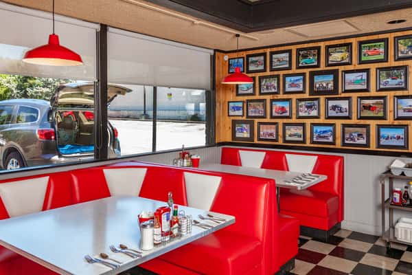 Interior of A-Town Diner with historical frames on wall