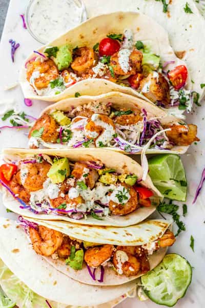 4 Shrimp tacos photographed from the top.
