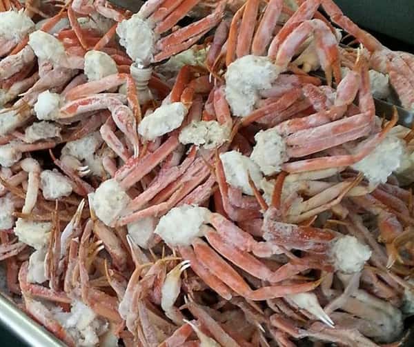 a huge pile of cooked crab legs