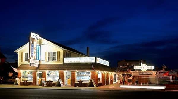 outdoor view of mike's seafood storefront at night