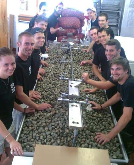 a row of workers shucking clams