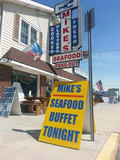 a sign that says "Mike's seafood buffet tonight"