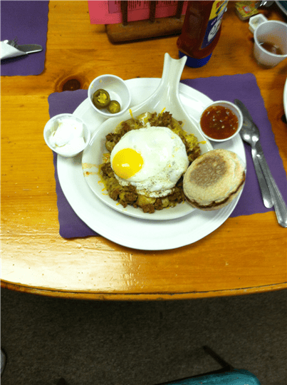 eggs on hash brown with various sides