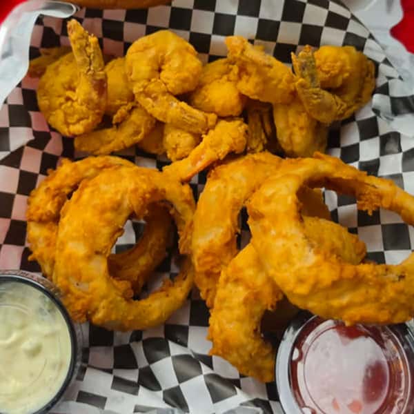 Fried onion rings served with dipping sauces