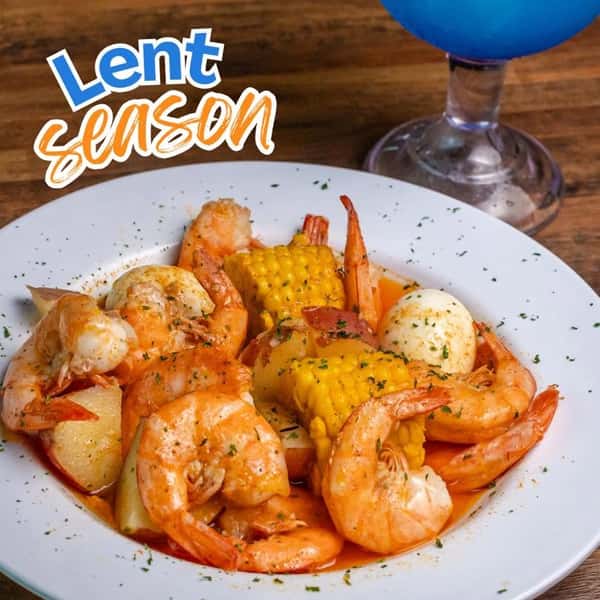 Seafood boil plate with shrimp, corn, and potatoes for Lent season