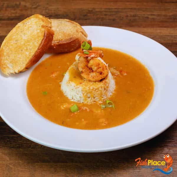 Shrimp and rice in seafood bisque, served with garlic bread
