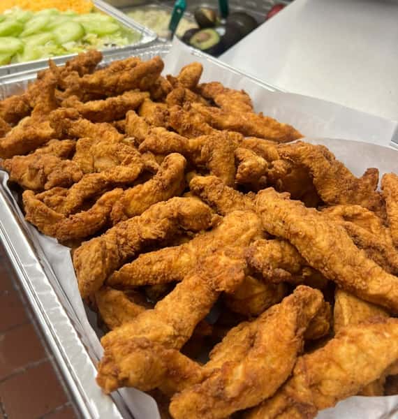 Large catering tray of fried chicken tenders