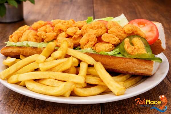 Plate of fried shrimp and fried fish served with french fries