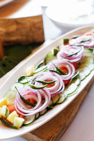 long dish with salad for catered event