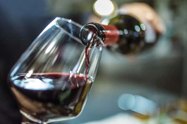 pouring glass of red wine