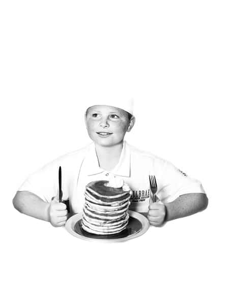 boy chef with pancakes